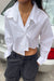 Cropped asymmetrical hem shirt in white — main image