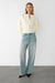 Cinched waist button front cardigan in cream — main image