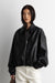 Vegan leather bomber jacket with pleats in black — main image