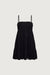 Smocked tiered mini dress in black — main image