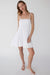 Smocked tiered mini dress in white — main image