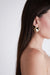 Circular flat earring in gold — main image