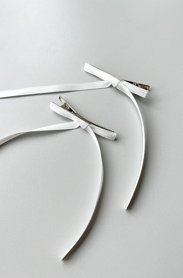 SET OF TWO LONG BOW HAIR CLIPS in Cream — alternate angle