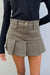 Cotton twill pleated mini skirt in mulled basil — main image
