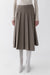 Midi pleated asymmetrical skirt in taupe — main image
