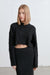 Cropped cable knit sweater in black — main image