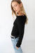 Cropped off the shoulder sweater in black — main image
