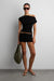Asymmetrical off the shoulder cap sleeve sweater in black — main image
