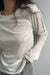 Sheer crewneck long sleeve top in cream — main image