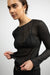 Exposed seam long sleeve top in black — main image