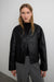 Collarless vegan leather jacket in black — main image