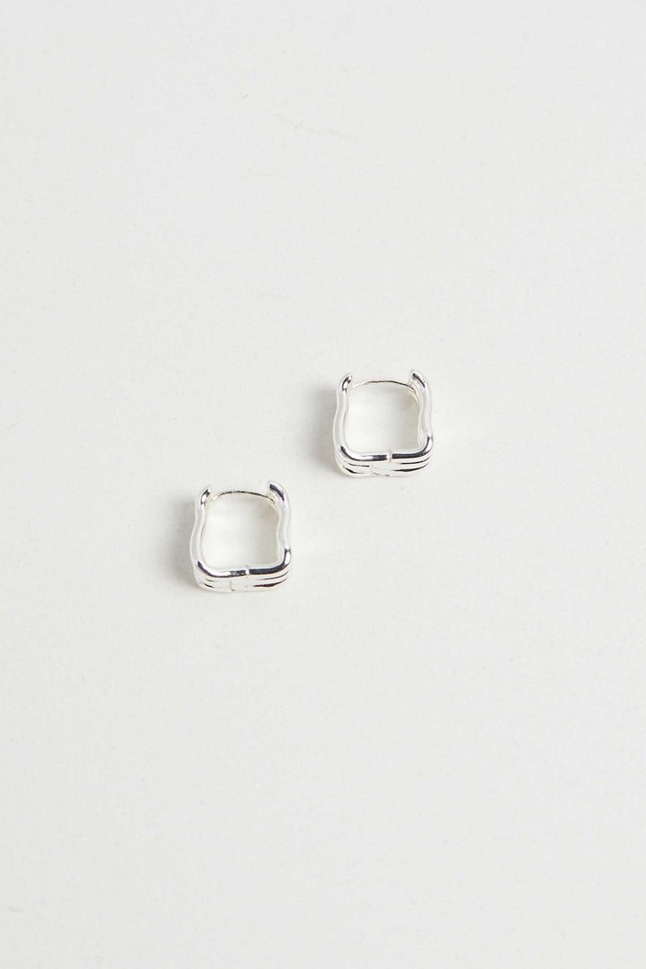 WAVY HUGGIE HOOPS in Silver — alternate angle