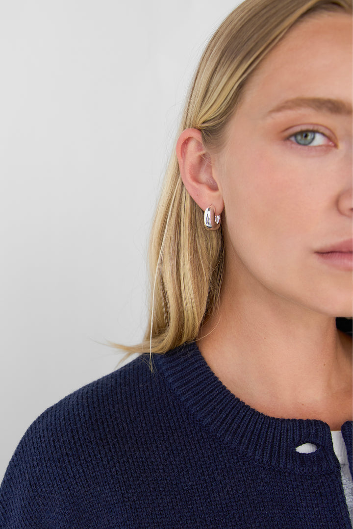 THICK HUGGIE HOOP EARRINGS in Silver — alternate angle