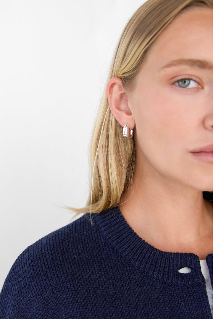 THICK HUGGIE HOOP EARRINGS in Silver — alternate angle